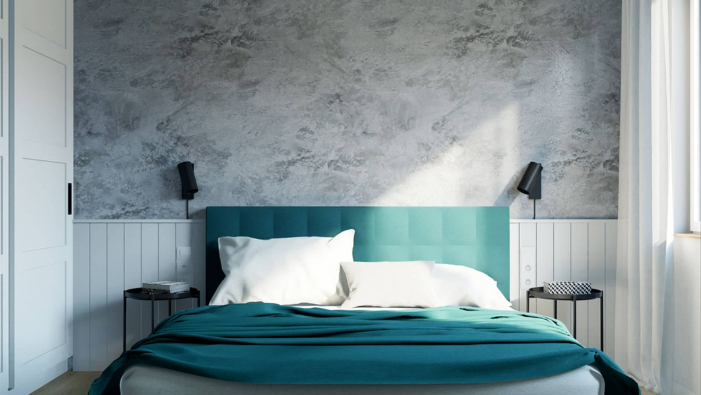 moderní ložnice s betonovou stěrkou na stěně a modrozelenou postelí